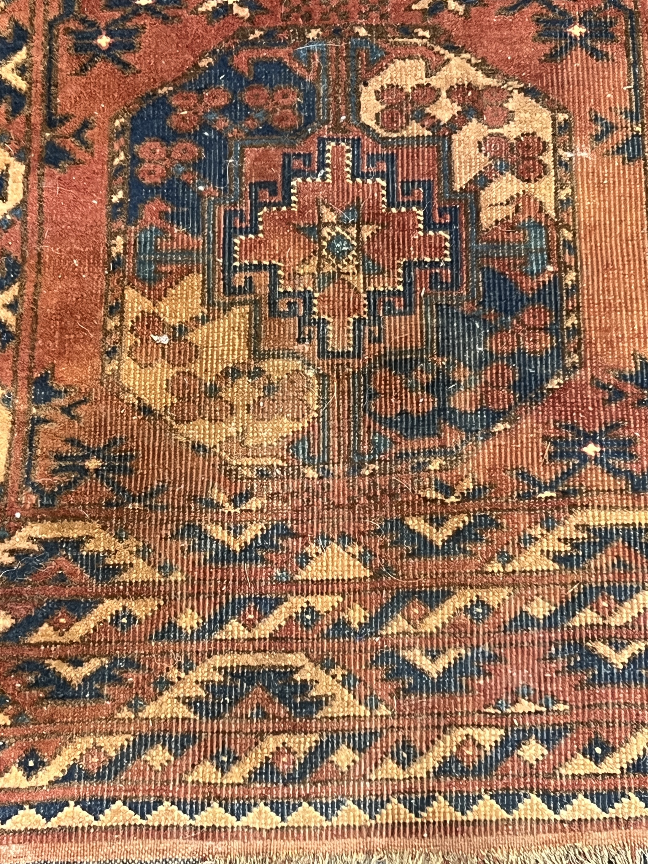 A Tekke red ground rug, 150 x 90cm
